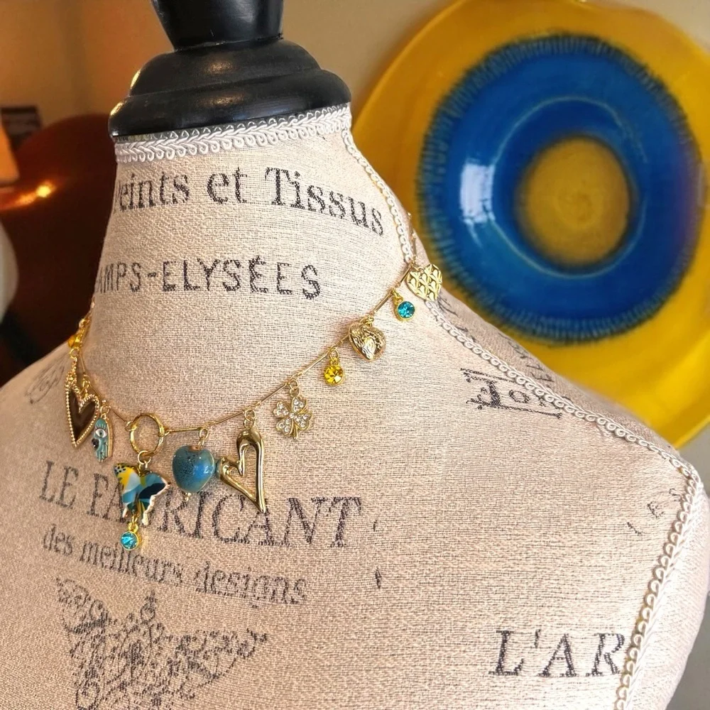 Unique and Gorgeous Gold toned Necklace with Varying Blue and Yellow Charms